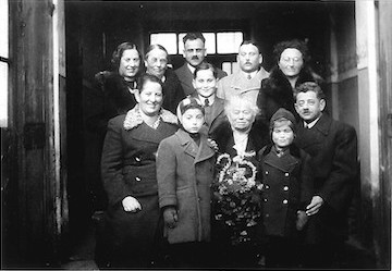 The Jokls during a 1938 family gathering in Chýnov. Upper row, left to right: Zdenka, Hana Hechtová (Berta and Olga’s sister), Hugo, Richard, Milada; middle row: Vladimír (standing); bottom row: Berta, Evžen, Alžběta, Věra, and Artur.